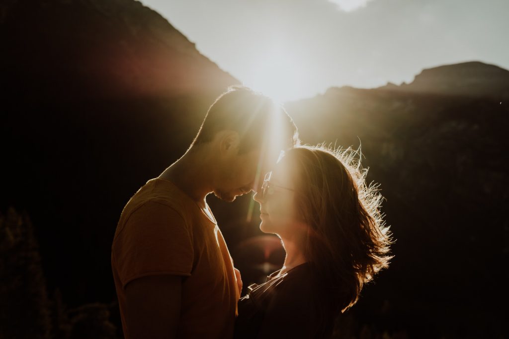 Silhouette of a couple at sunset by adventure wedding photographer Wild Connections Photography