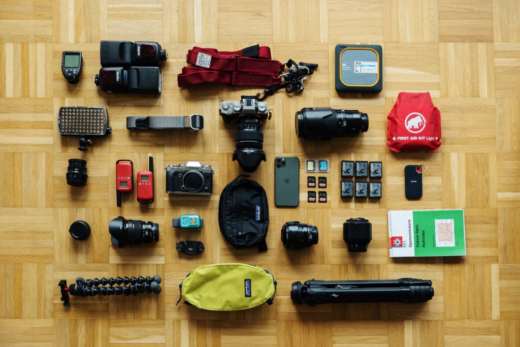 All the equipment I use for my elopement photography business laid out on the floor