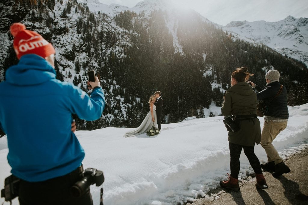 Photographers capture models at an elopement photography business workshop in the Austrian Alps