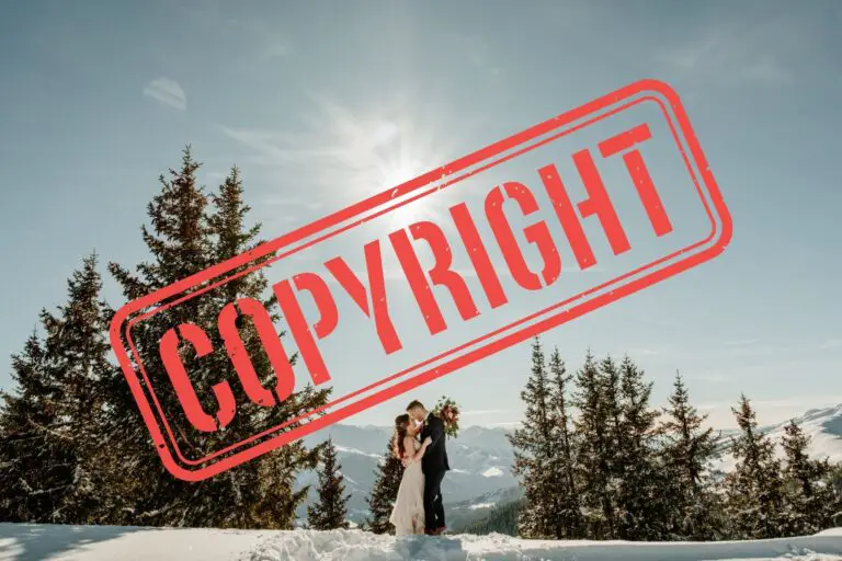 Bride and groom kissing on a snowy mountain with the word COPYRIGHT written in big red letters across it.